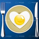 Breakfast Set with a Fork, a Knife, a Plate and a Heart Shaped Egg